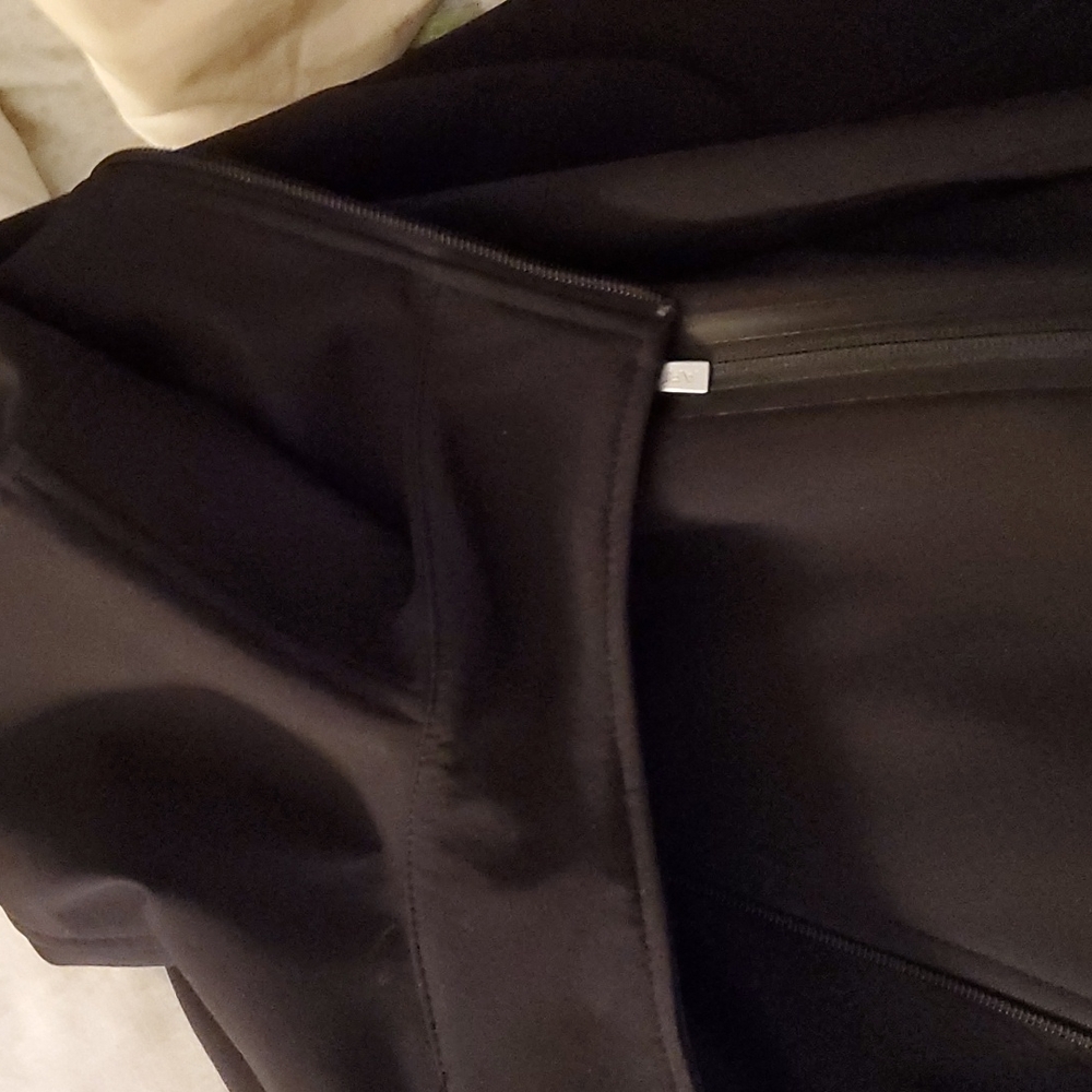 Ariat size medium jacket not faded try on once lighting makes look faded